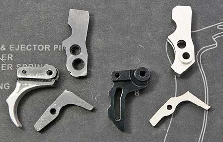 Original Ruger trigger parts on the left, new TandemKross Ultimate Trigger Kit parts on the right