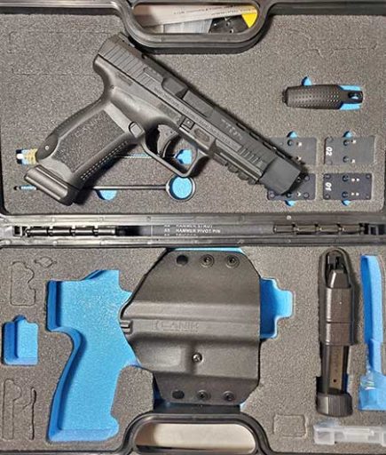 Canik TP9SFx 9mm pistol shown with factory hard case and included accessories