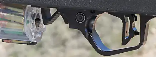 Close-up of the TandemKross Manticore LITE trigger assembly and magazine release on the TKX22 Light Rifle.