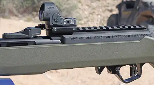 Close-up of the TandemKross TKX22 Light Rifle receiver, rail, and mounted reflex optic.