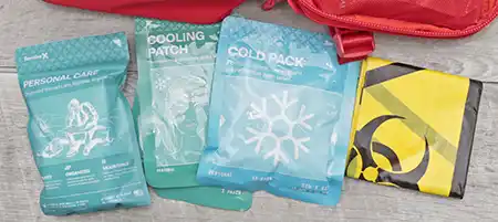 Cold pack, cooling patch, personal care items, and biohazard bag from the SurviveX kit