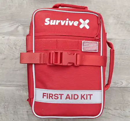 Closed SurviveX Large First Aid Kit with red soft-sided bag