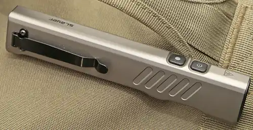 Coast Slayer flashlight showing the pocket clip, side styling, and top controls