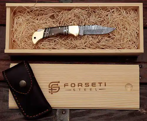 Forseti Steel Hemingway Damascus pocket knife in wood presentation box with leather sheath