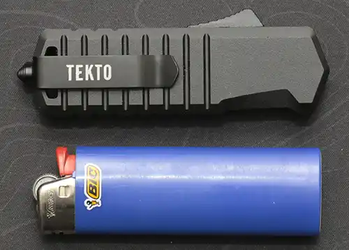 Tekto A2 Badger automatic knife with Bic lighter for size comparison