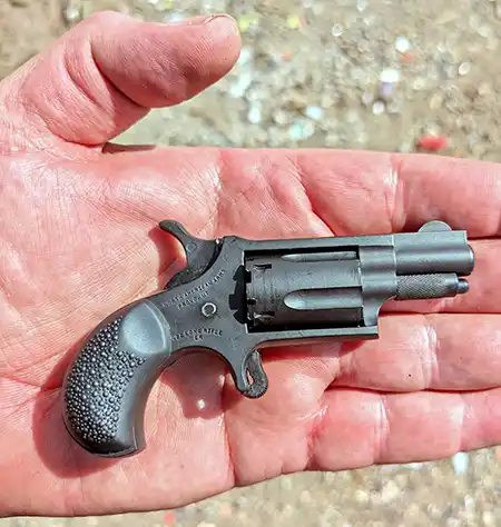 NAA Mini-Revolver with rubber grip resting in an open hand