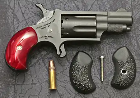 NAA Zorro revolver with factory grips and rubber pebbled replacement grips