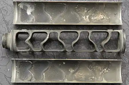 Dirty SilencerCo Sparrow 22 monocore and clamshell halves after hundreds of rounds